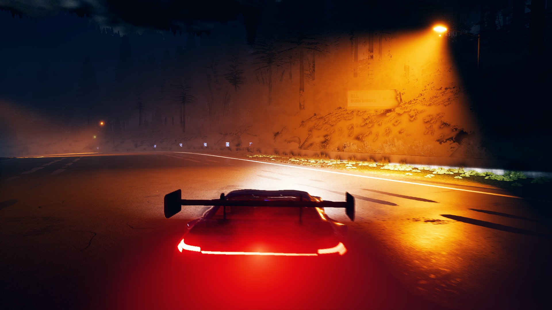 Night hairpin, headlights in the fog